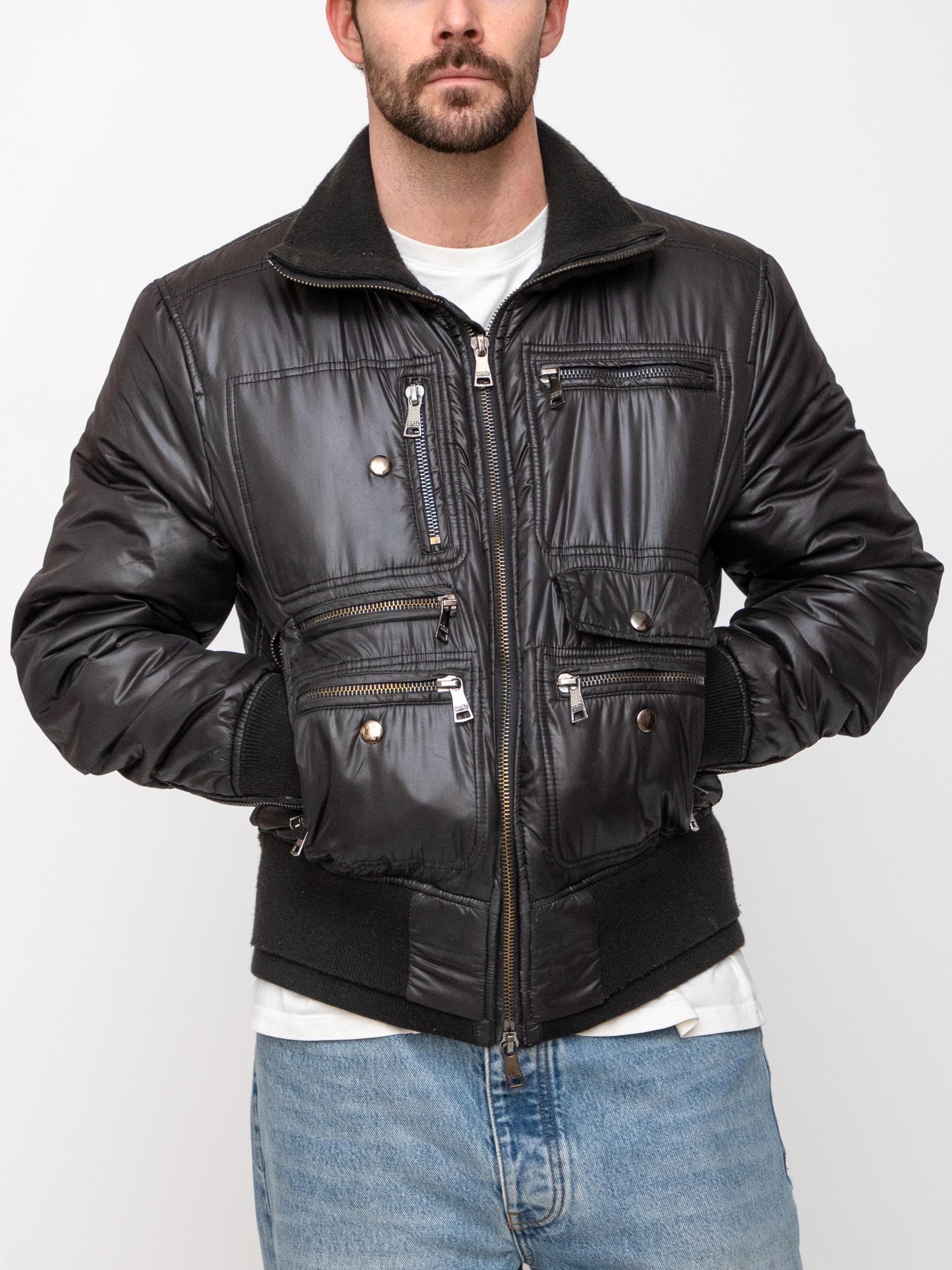 Winter early 00's black double zip technical coat with cargo style pockets and a ribbed collar and elasticated ribbed waist and cuffs - Image 1