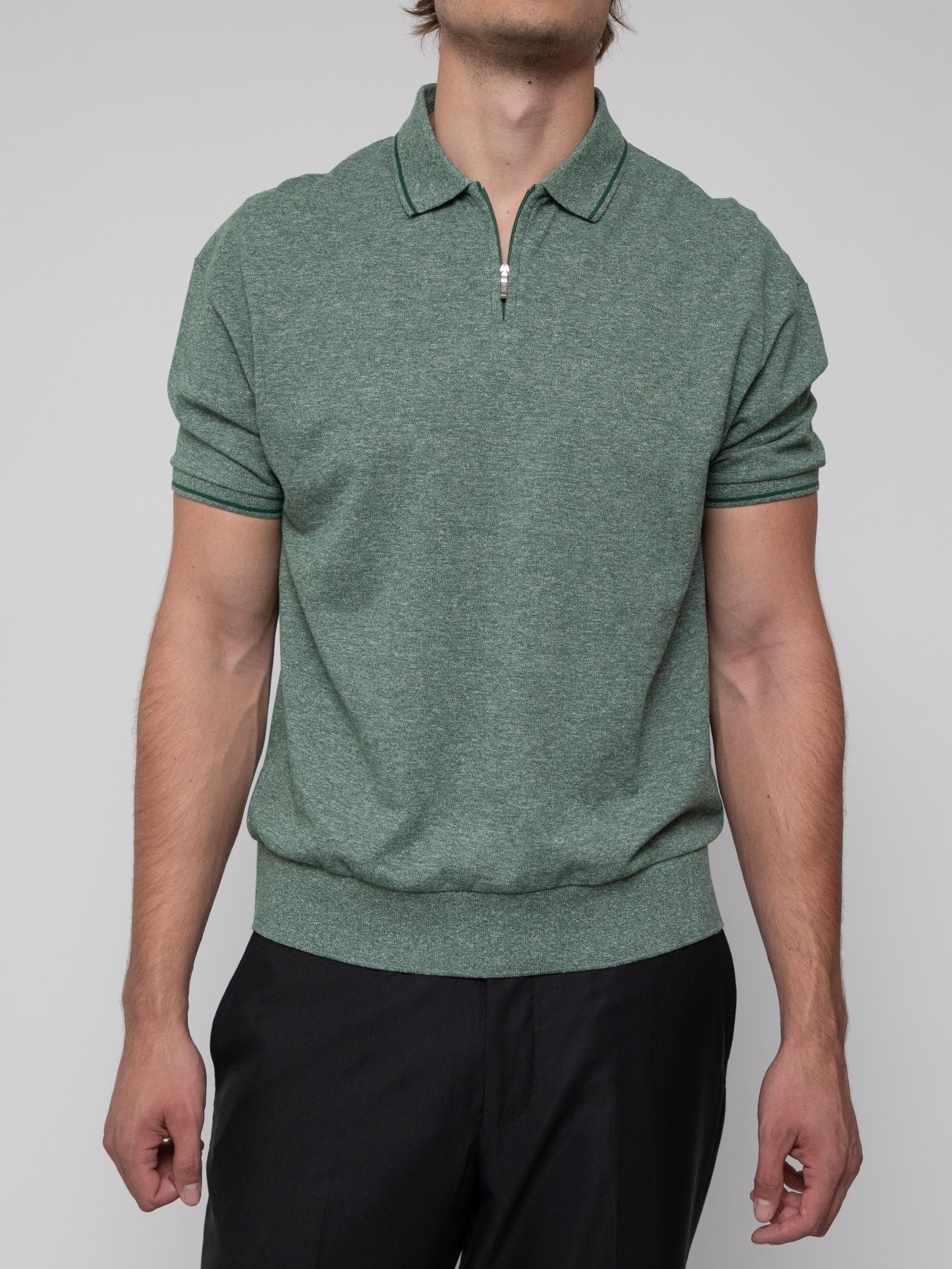 Spring early 10's green zip polo top with piping collar and matching cuffs, and ribbed elasticated hem - Image 1