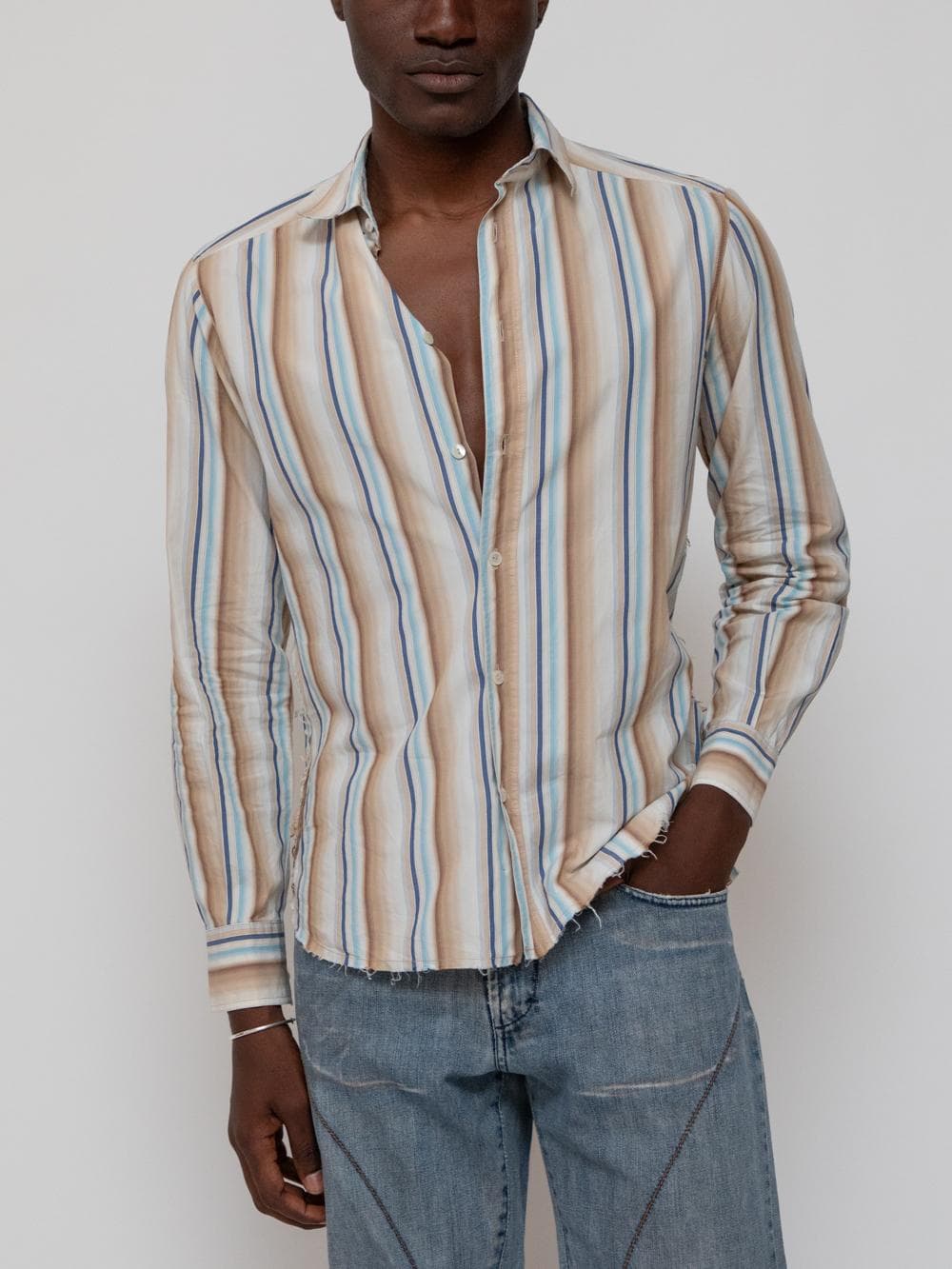 Spring late 00's Vintage Limited Edition blue, tan, and brown striped button shirt with pearlised logoed buttons and embroidered Batman on the back, also features frayed hem and side seams - Image 1