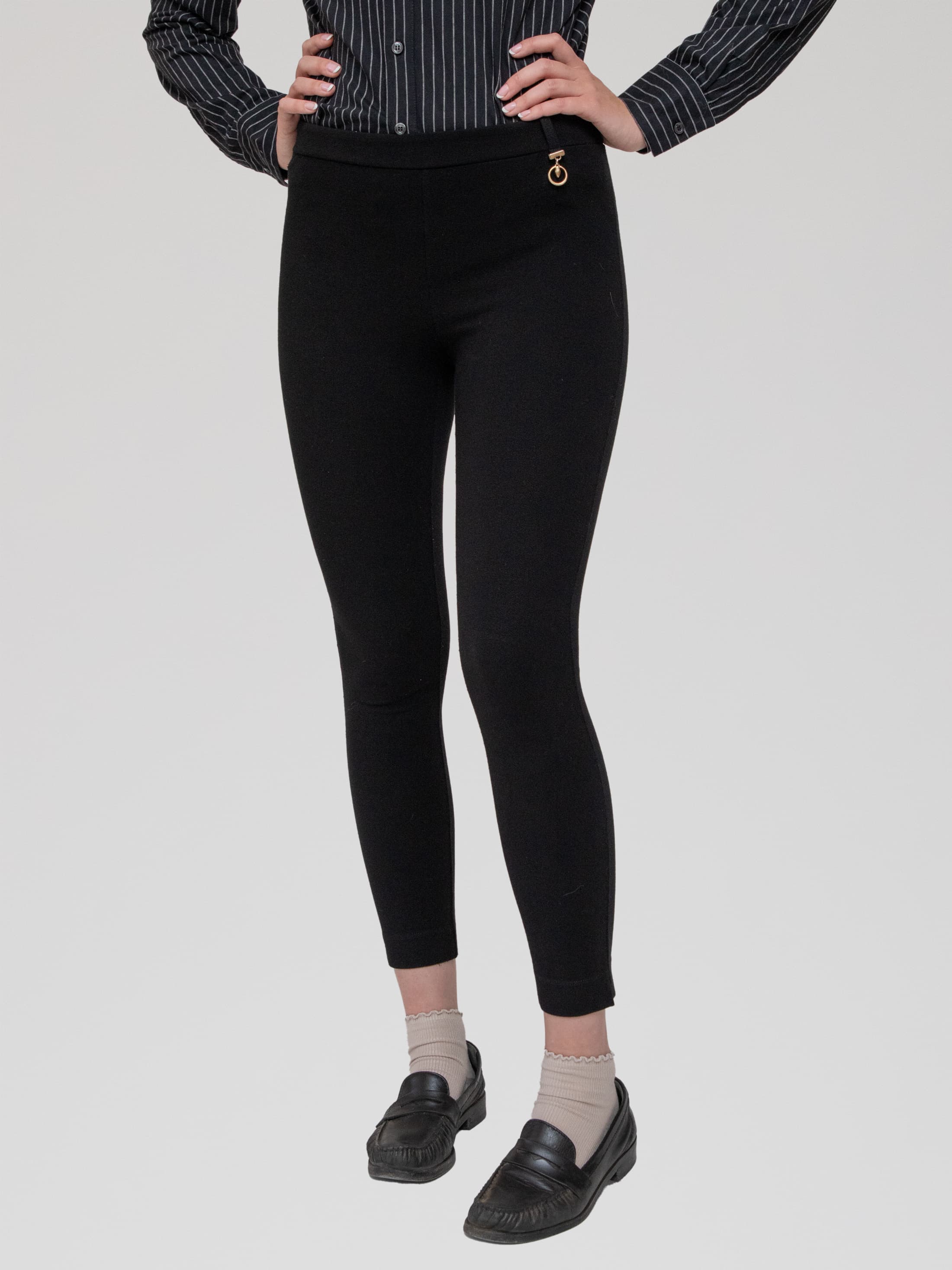 Late 00s black leggings with circular snake charm attached to front waistband - Image 1