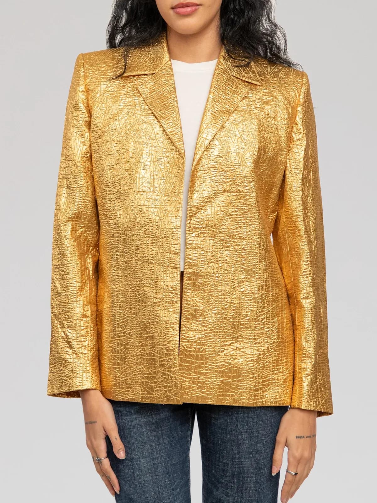 Metallic gold crushed-texture single-breasted blazer featuring notch lapels, structured shoulders, open-front design, and three dark accent buttons at each cuff. - Image 1