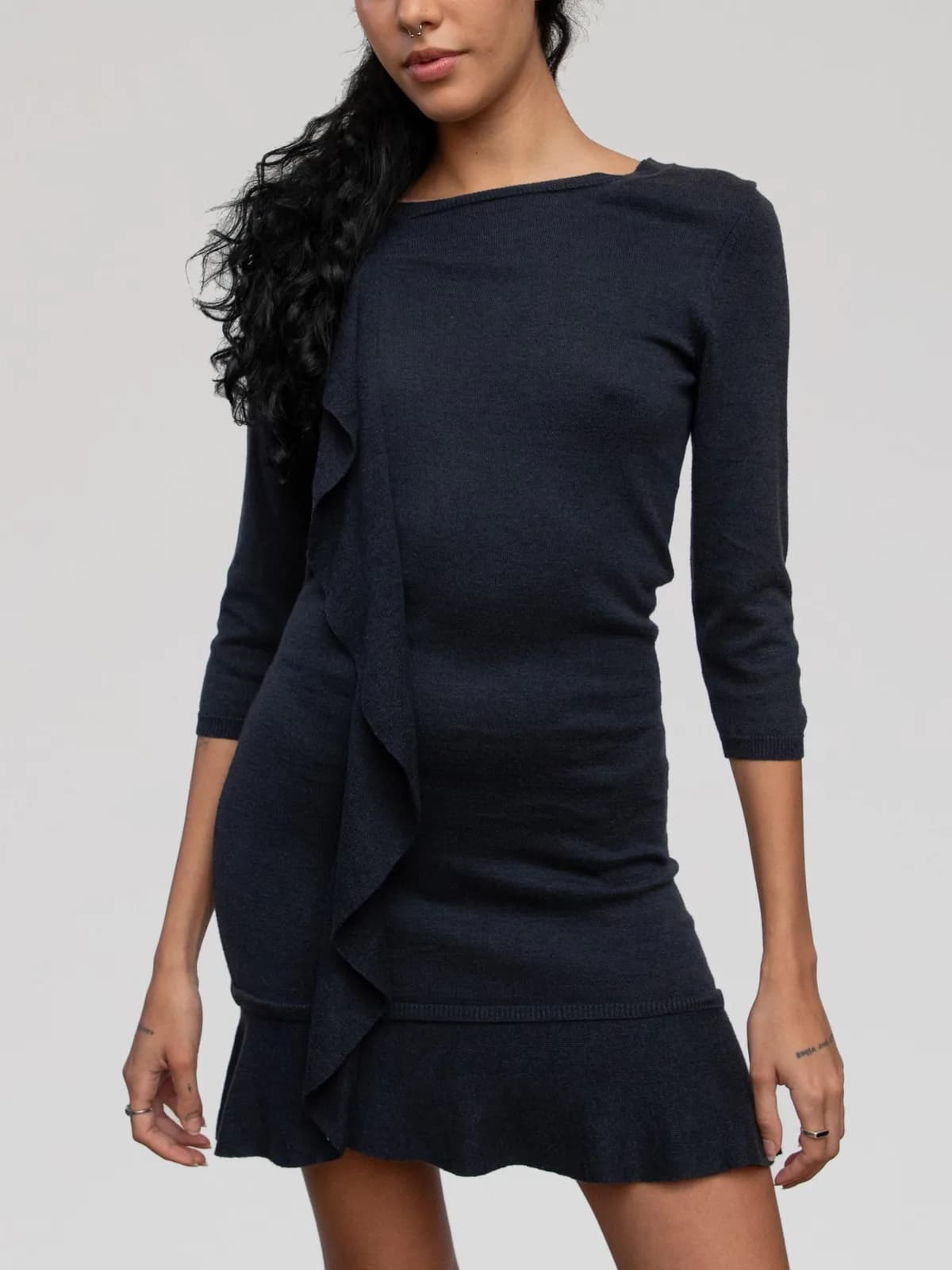 Valentino charcoal grey fine-knit mini dress featuring 3/4-length sleeves, a boat neckline, a vertical cascade ruffle along the right side, and a ruffled drop-waist flounce hem. - Image 1