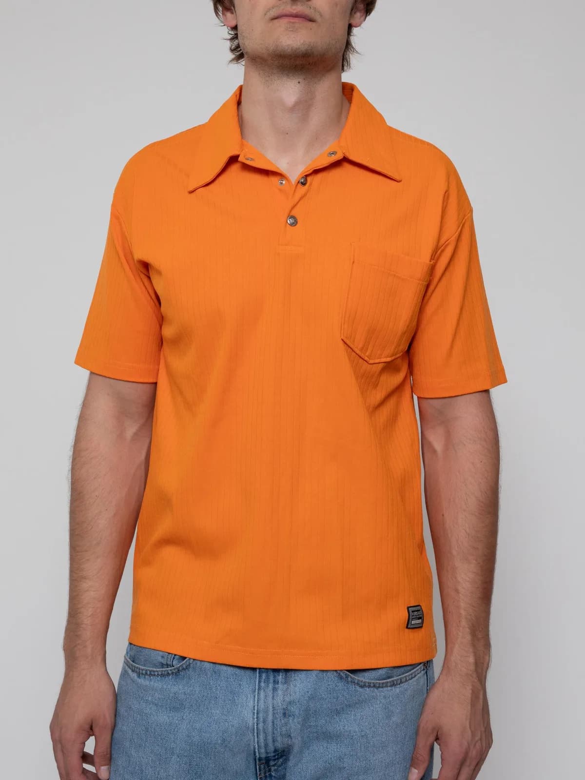Late 00's orange point collar polo shirt with versace Medusa engraved popper button placard - Image 1
