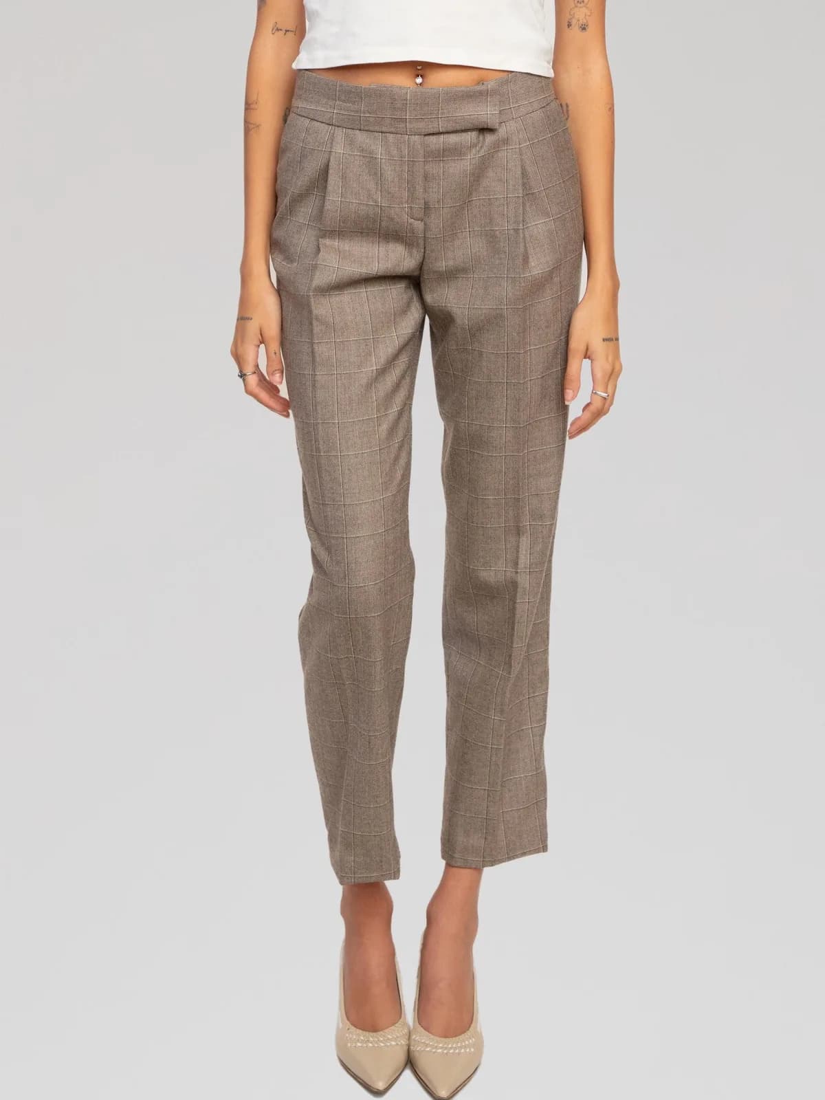 Salvatore Ferragamo pleated tailored trousers featuring a subtle taupe-brown windowpane check pattern. Cut in a high-waisted, tapered crop silhouette with front pleats, pressed creases, side slip pockets, a single back welt pocket, and an extended tab waistband with concealed closure. Made in Italy. - Image 1