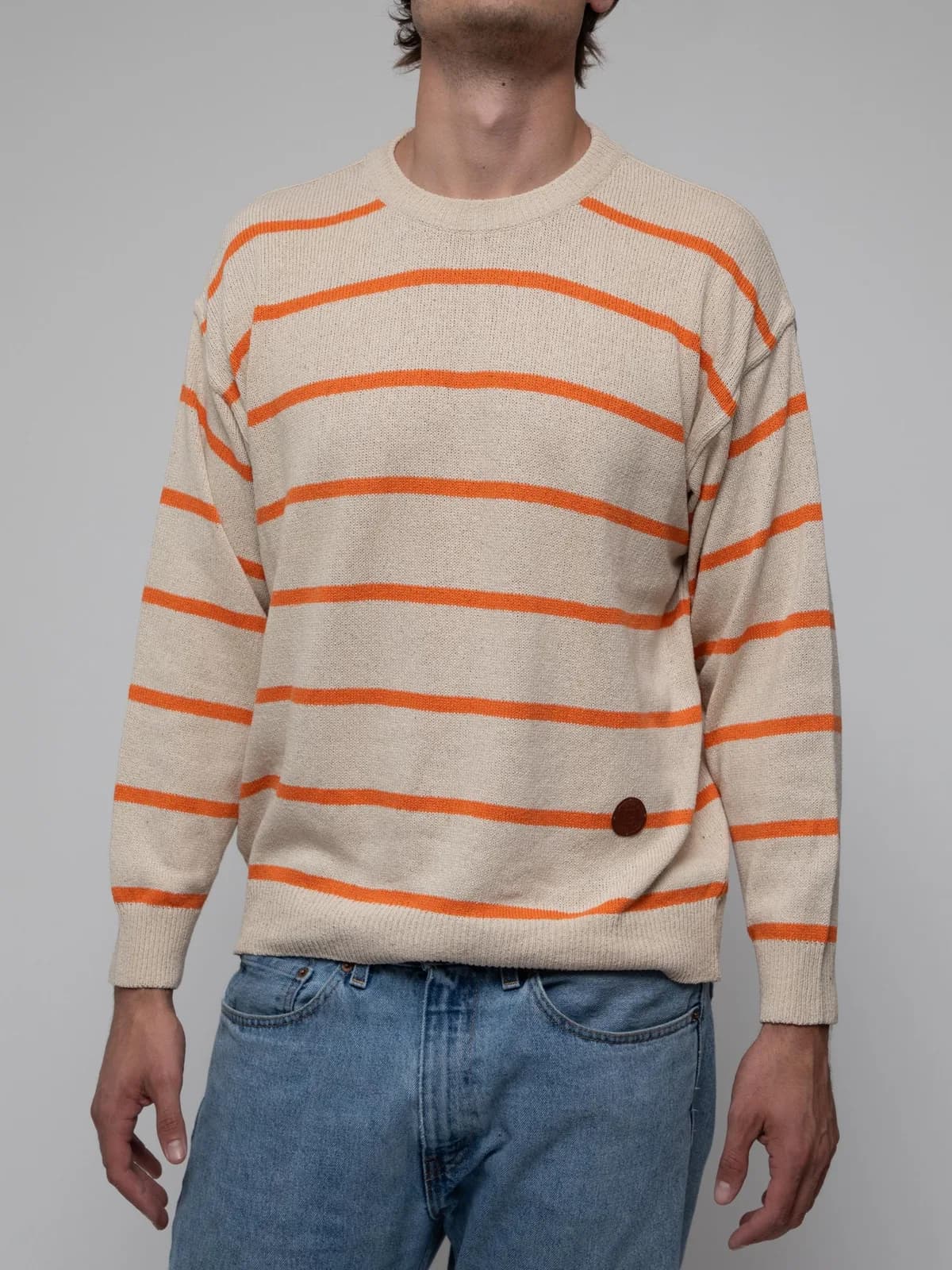 Early 00's crew neck silk sweater in cream with thin orange band striping and a leather Fendi patch on the bottom front left side - Image 1