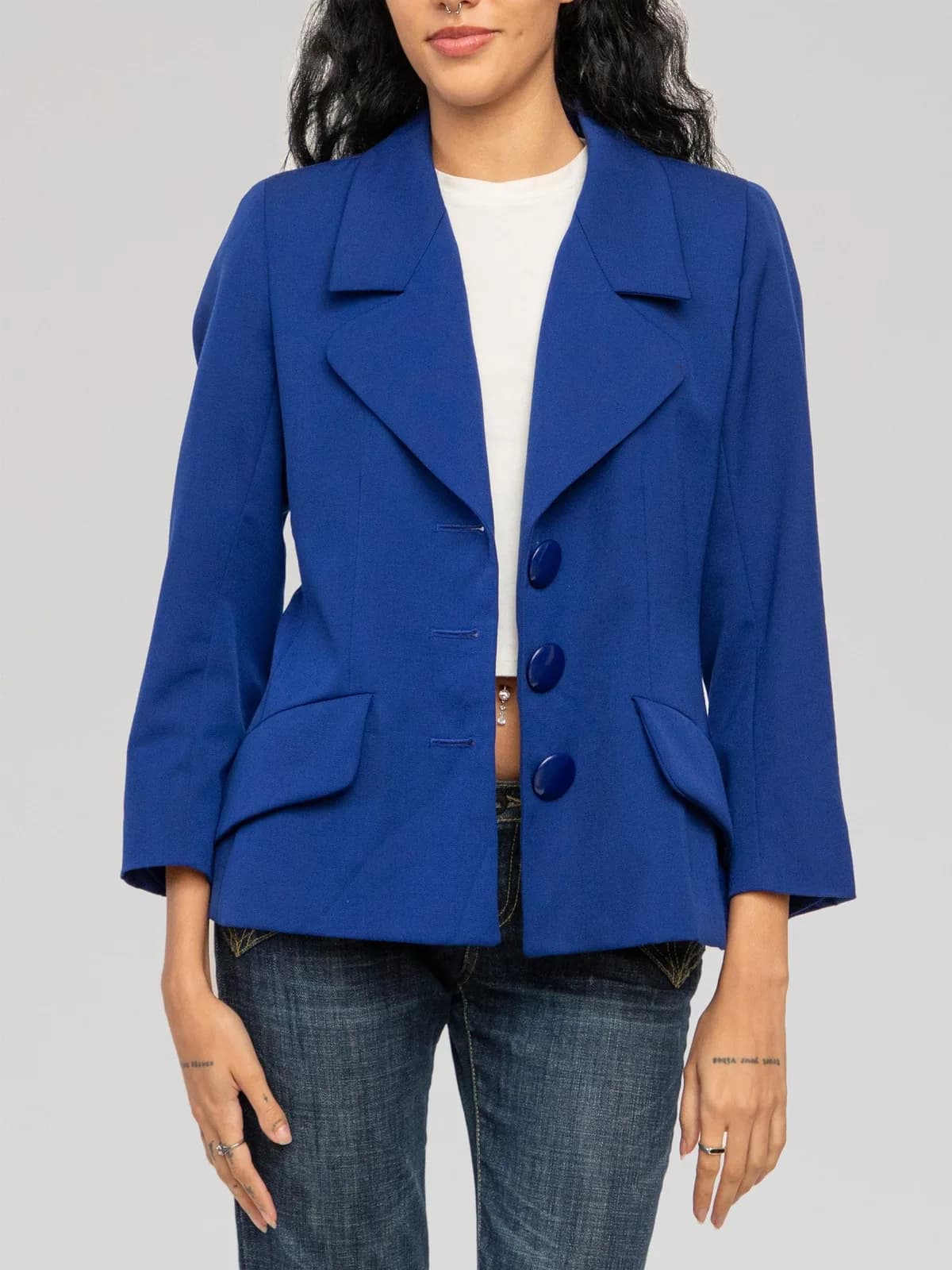 Yves Saint Laurent Rive Gauche electric royal blue structured blazer featuring wide notch lapels, a three-button front closure with oversized tonal round buttons, flap hip pockets, and full interior lining. Made in France. - Image 1