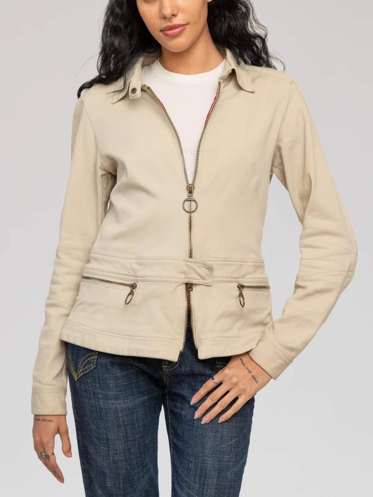 Prada Sport (Linea Rossa) beige fitted utility jacket crafted from a cotton-nylon blend with red taped interior seams, featuring a full zip closure with ring pullers, a point collar, front horizontal zip pockets, waist tab detail, and subtle articulated elbow stitching. Made in Italy. - Image 1