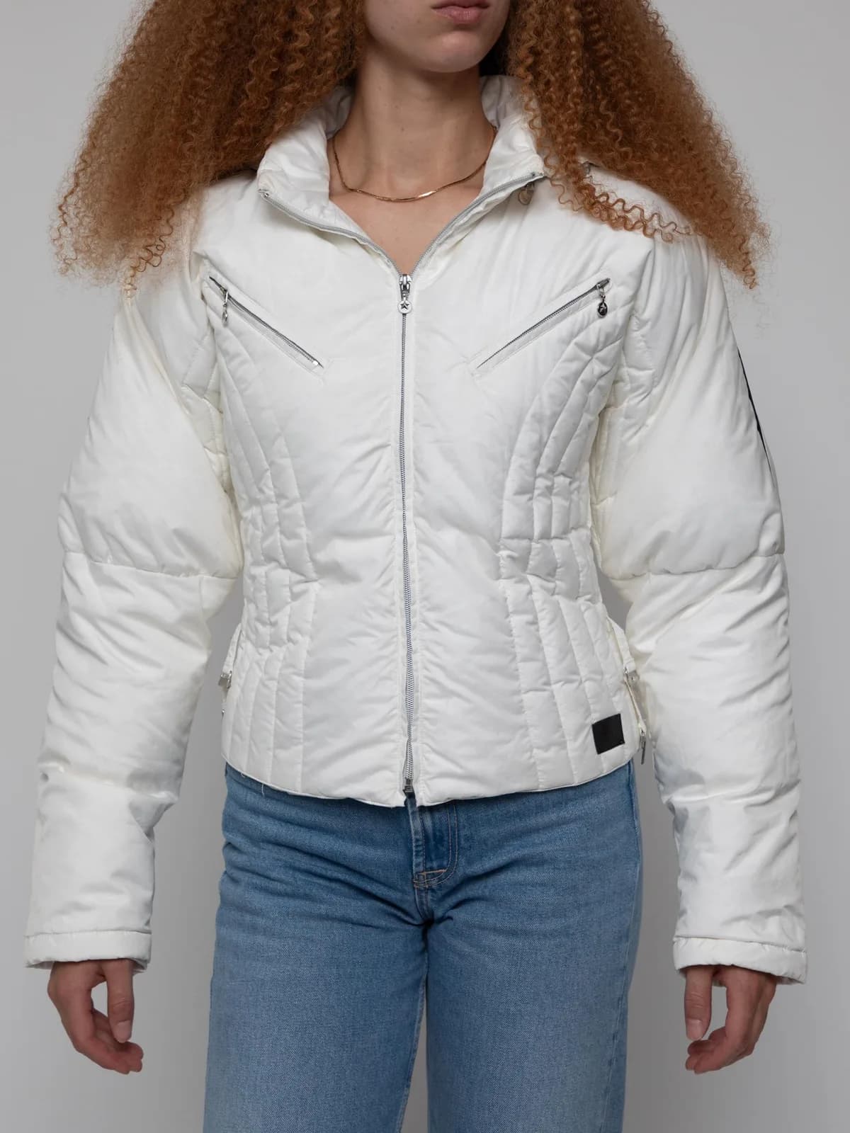 Mid 00's white puffer jacket with slant zip chest pockets and side waist cinchers - Image 1