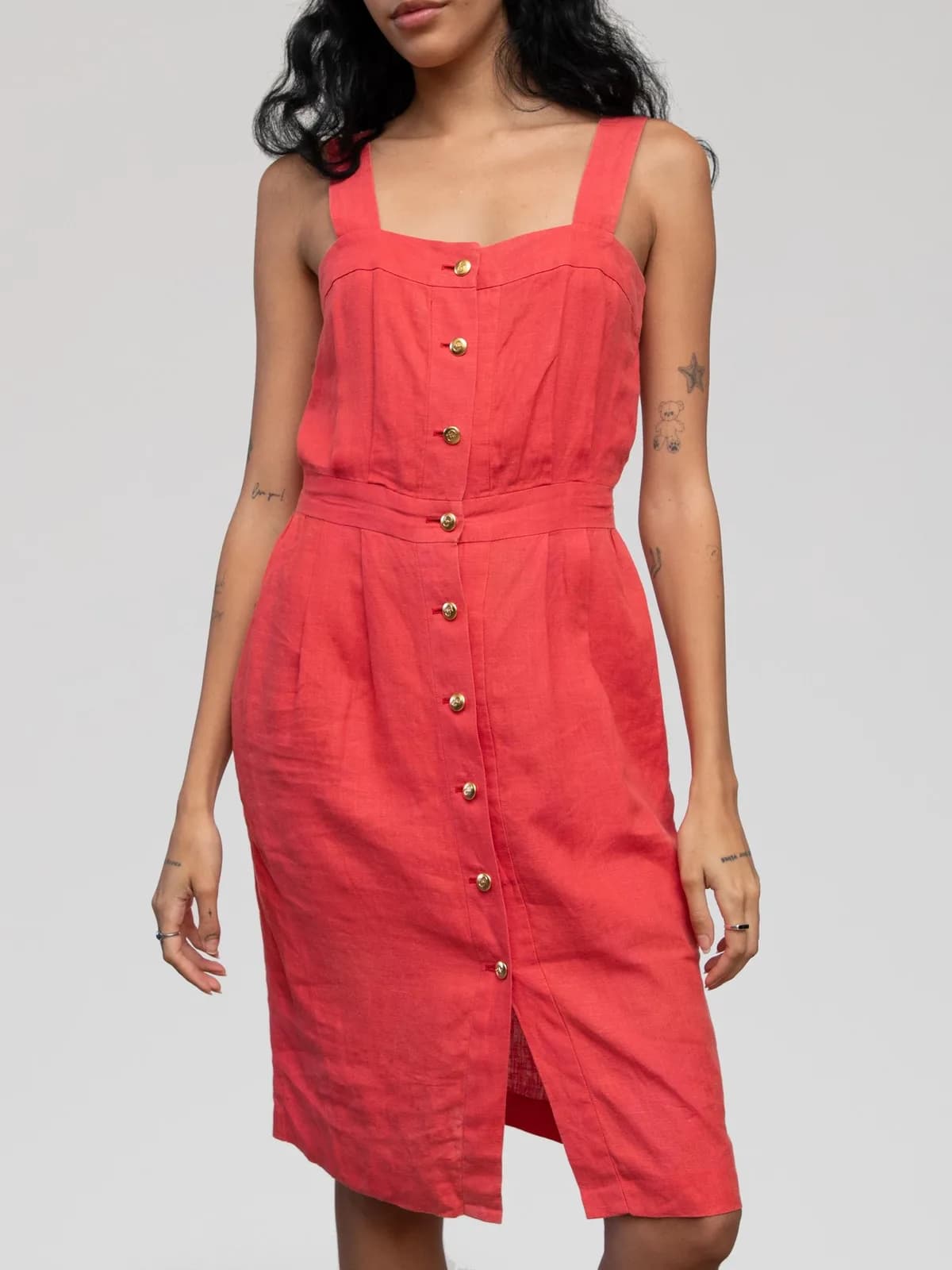 Christian Dior coral red linen sun dress featuring thick tank straps, a square neckline, a tailored fitted bodice with pleating, a defined waist, gold-tone front button-down closures, and a knee-length sheath skirt with a front hem slit. - Image 1