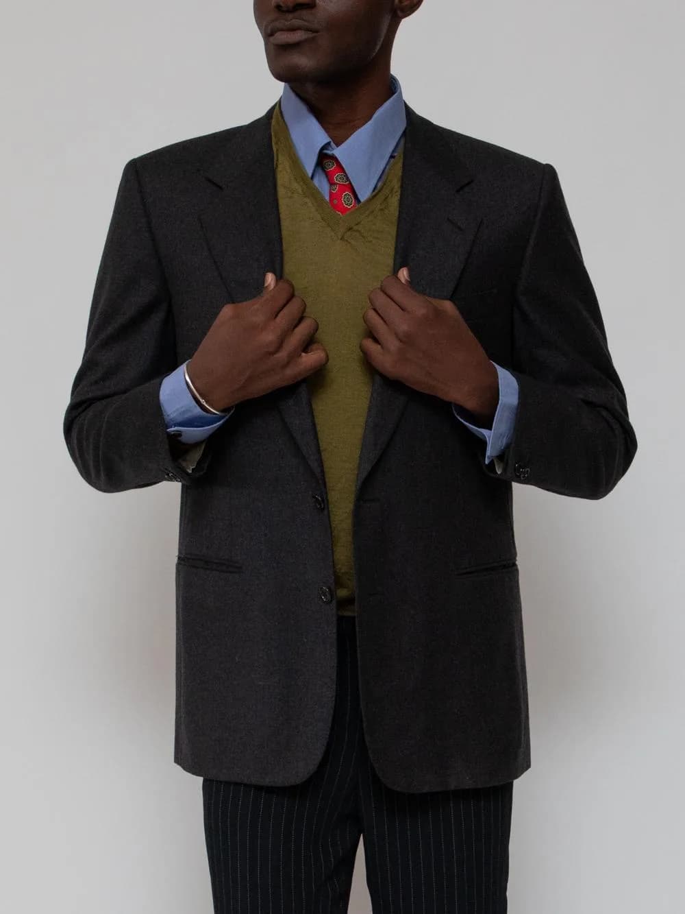 Late 80's grey worsted wool 2 button blazer with notch lapels and slit pockets, also features a double vent. - Image 1